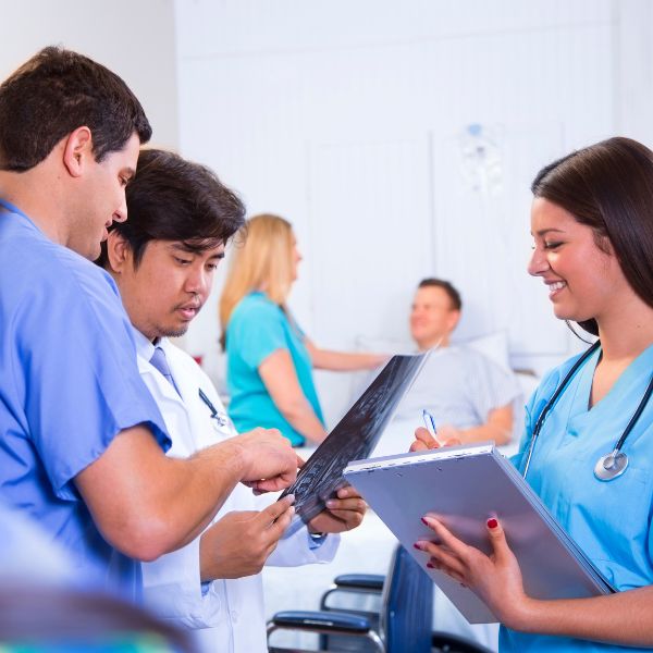 A group of nurses discussing something
