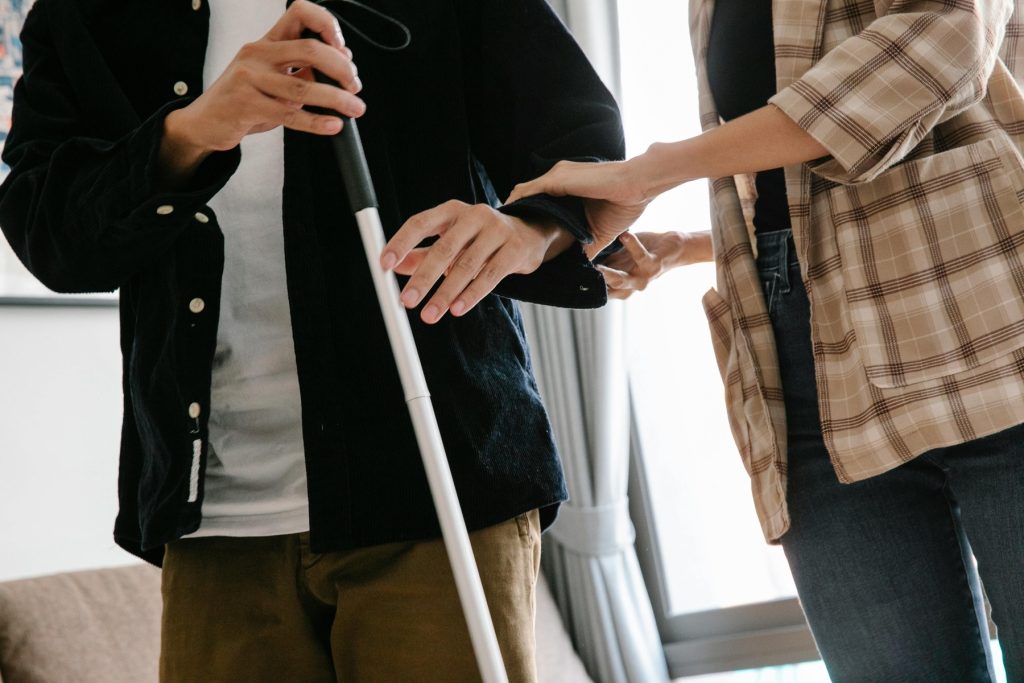 A woman assisting a patient walking