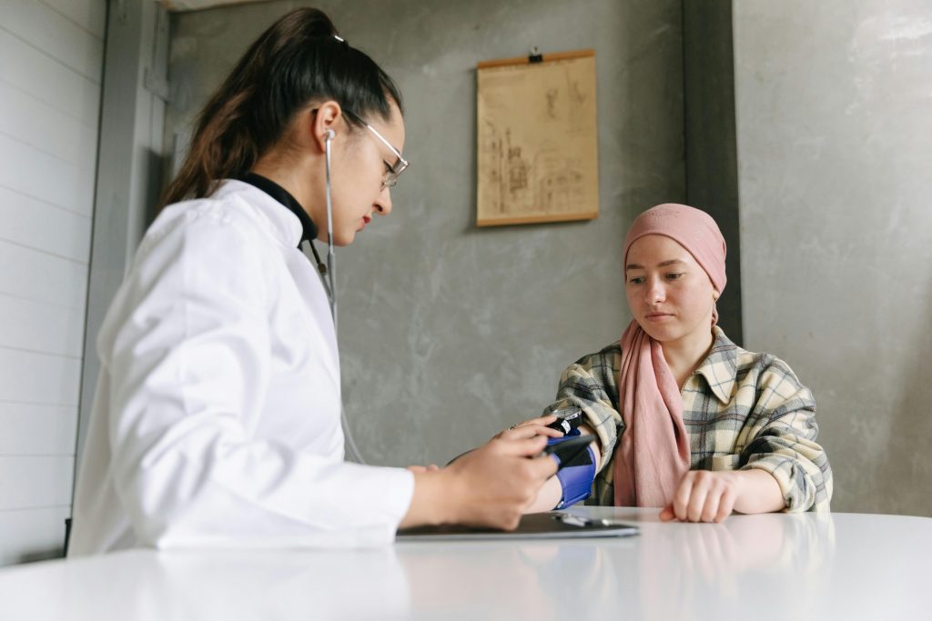 A healthcare staff checking a woman