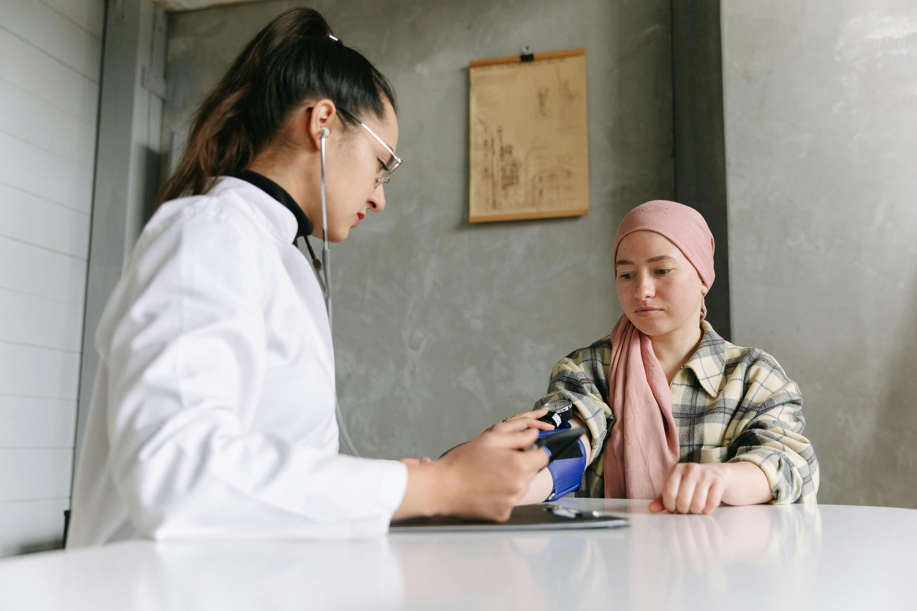 A healthcare staff checking a woman