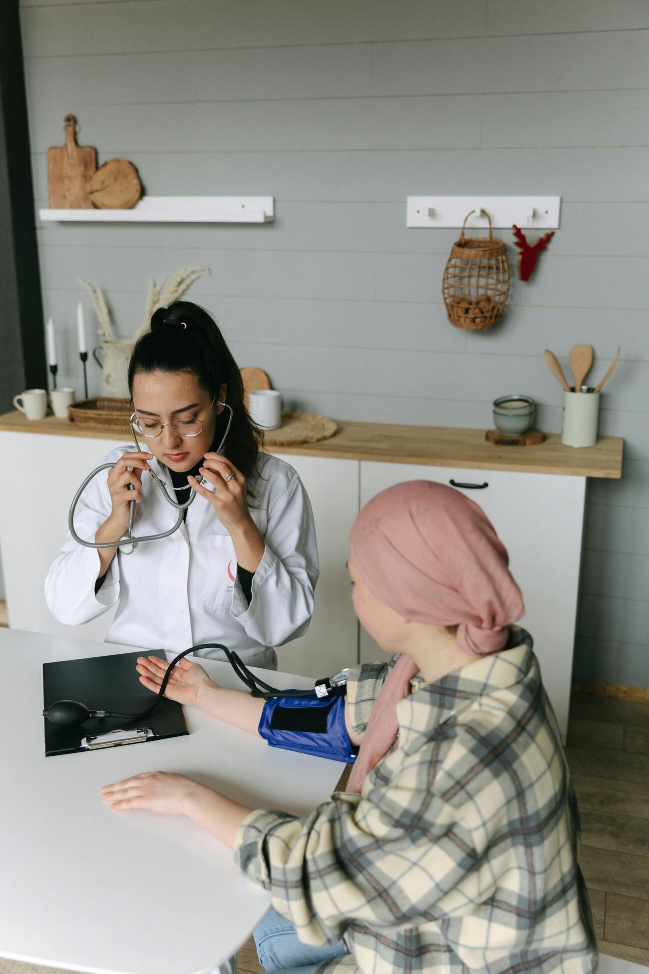Doctor listening to patient with stethoscope